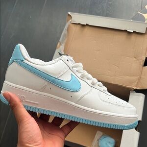 Nike White Low-Top Sneakers with Sky Blue Swoosh
